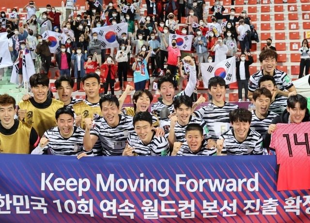 South Korea celebrate after their win against Syria in Dubai